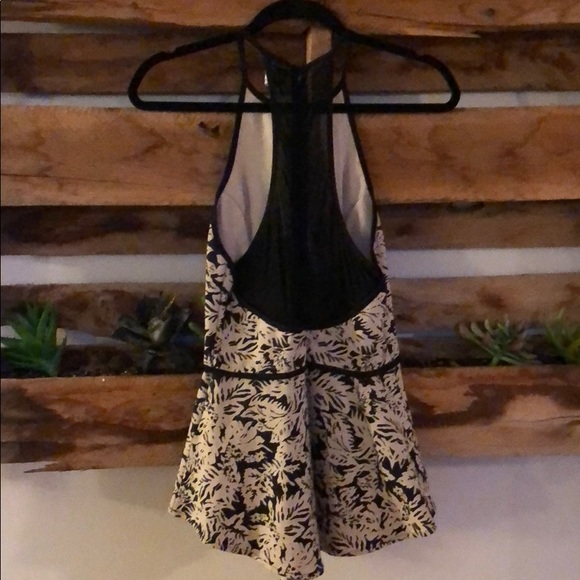 Peplum top with black mesh detailing in the back - Picture 2 of 2